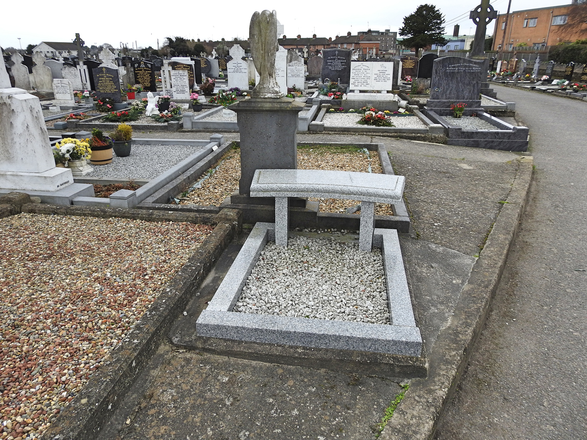 2nd February 2023, Drogheda, County Louth, Ireland. Marble bench next to a grave in a cemetery.